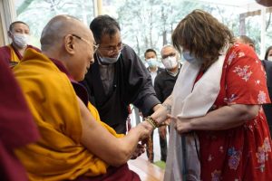 Dalai Lama sees the tattoo of the Buddha Eyes